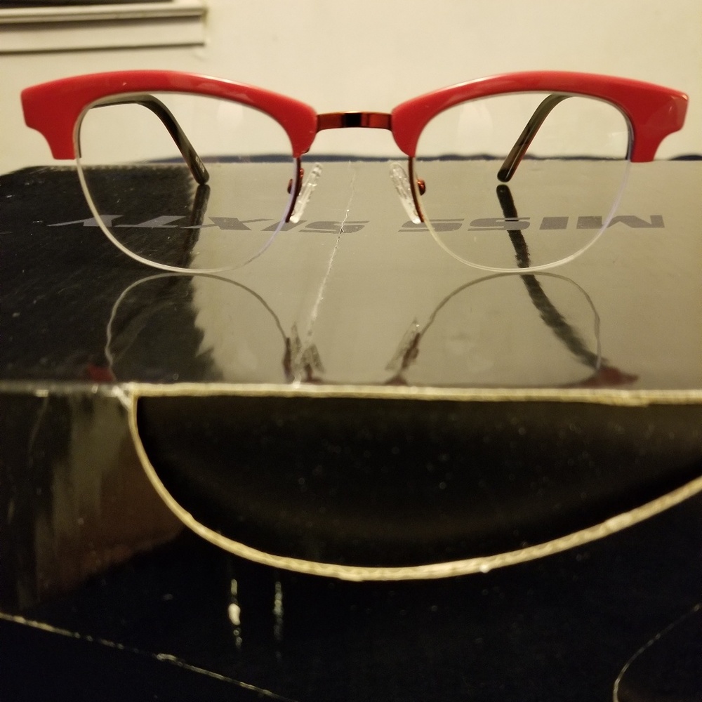Red rimless eyeglass frames